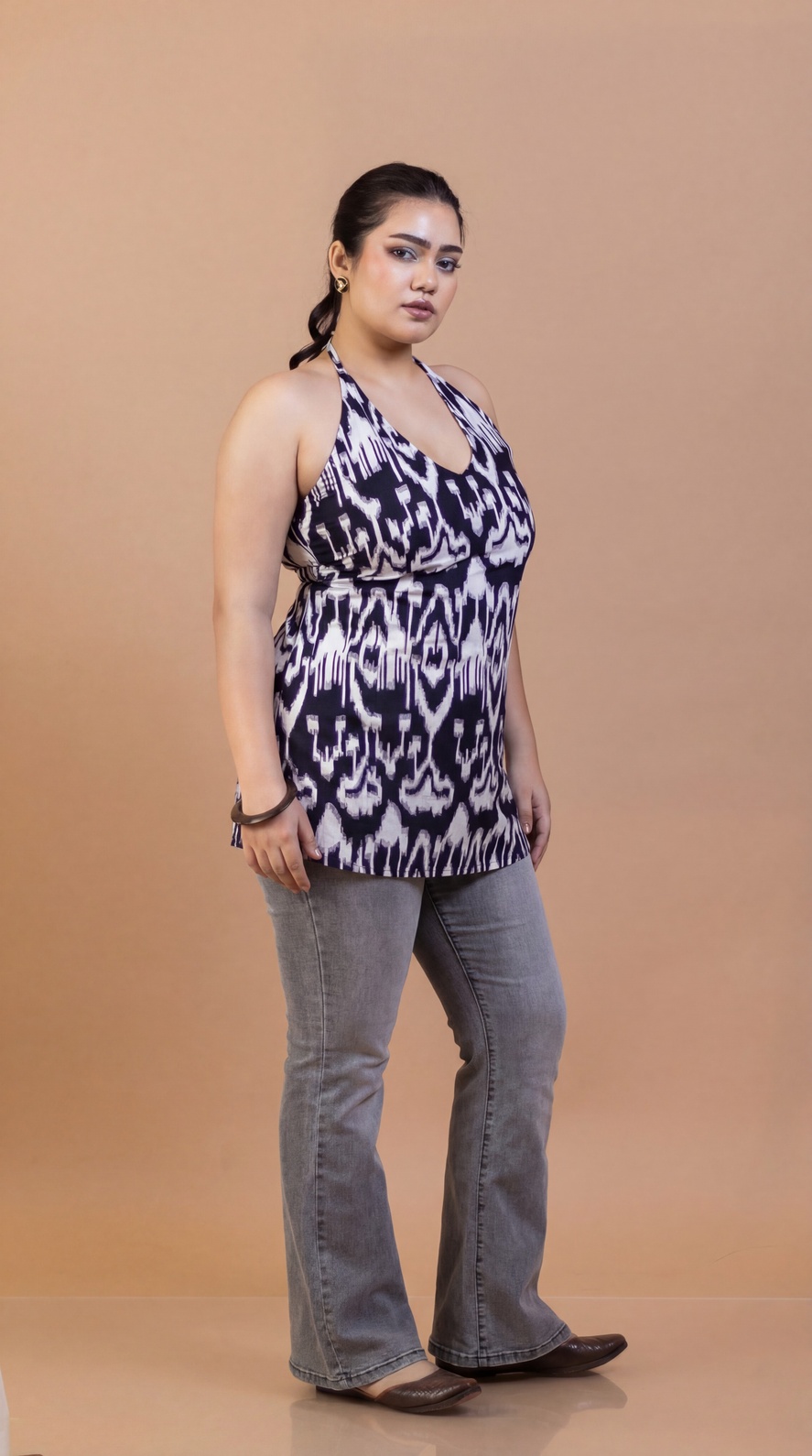 Black halter neck kurti paired with distressed bottom