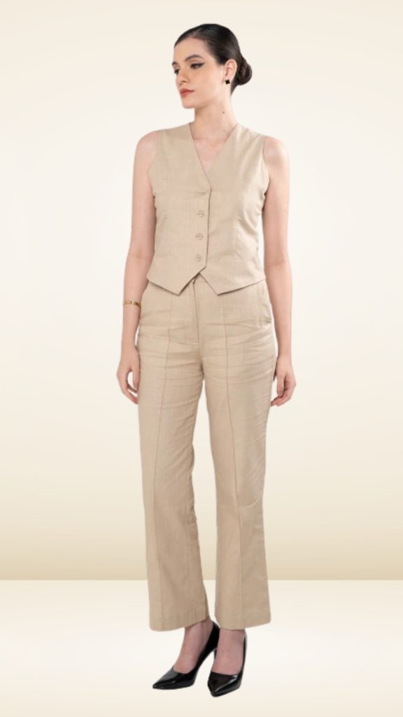 Beige formal co-ord set with bun hairstyle