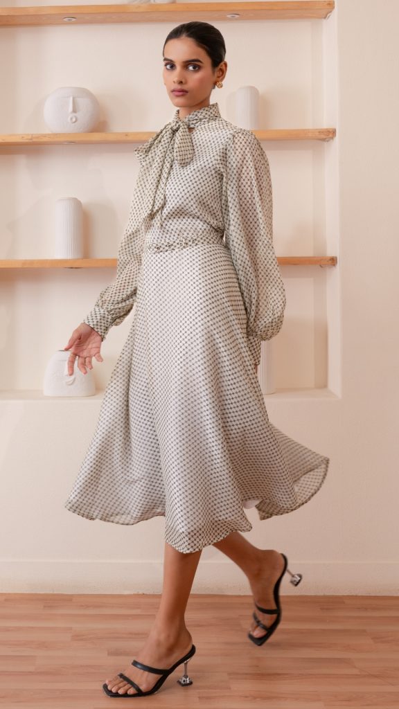 Off-White Formal Tie-up Neck Bishop Sleeve Fit and Flare Dress with braided hairstyle