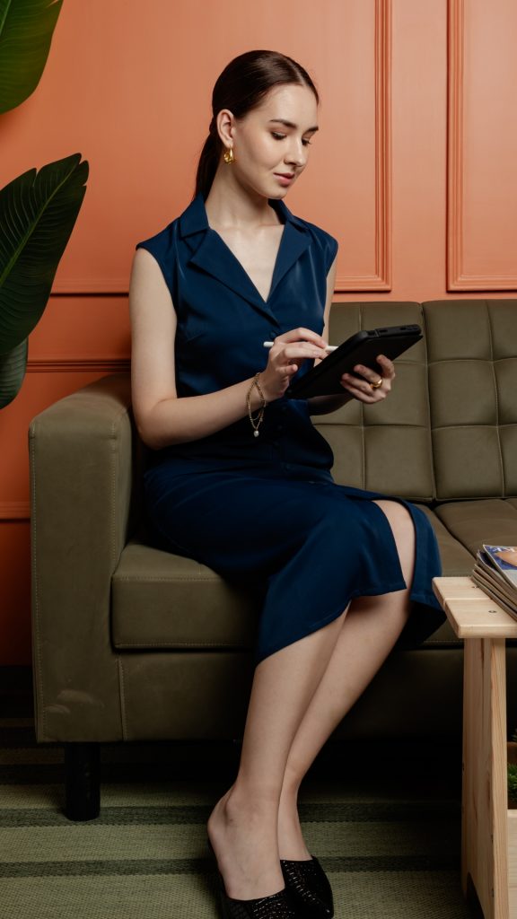 Stylish bun hairstyle with blue formal dress